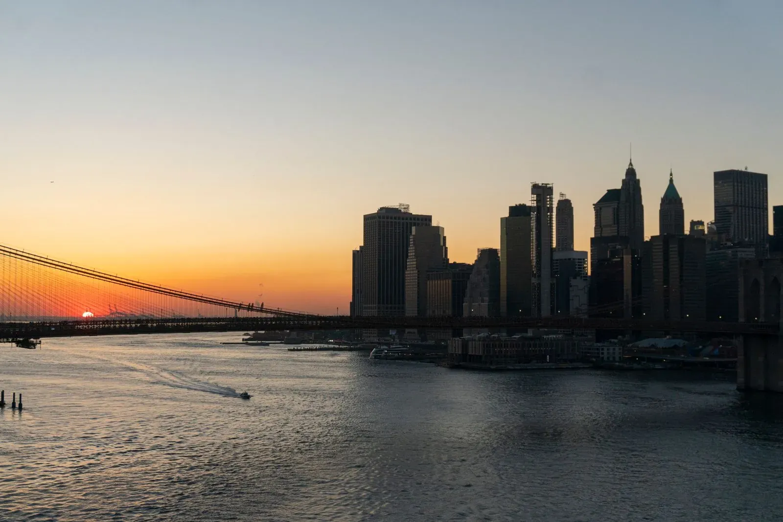 The Brooklyn Bridge and the Manhattan skyline at sunset