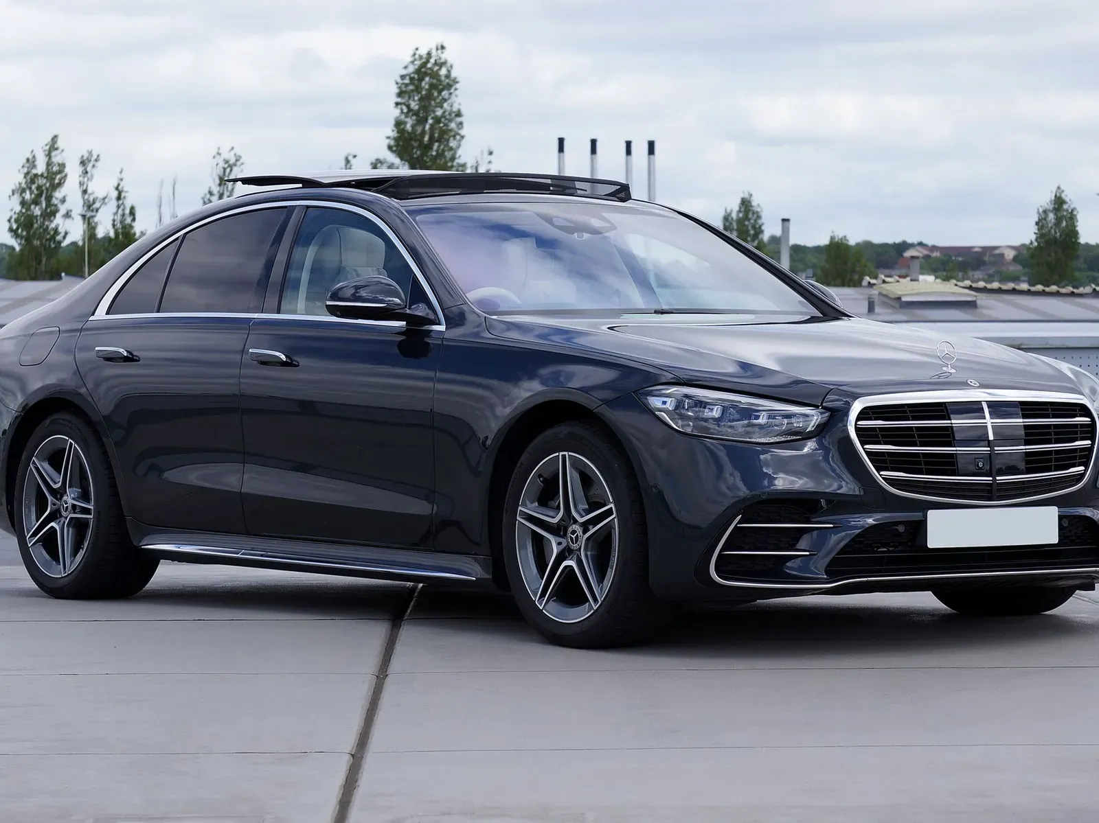 A black Mercedes-Benz S-Class luxury sedan