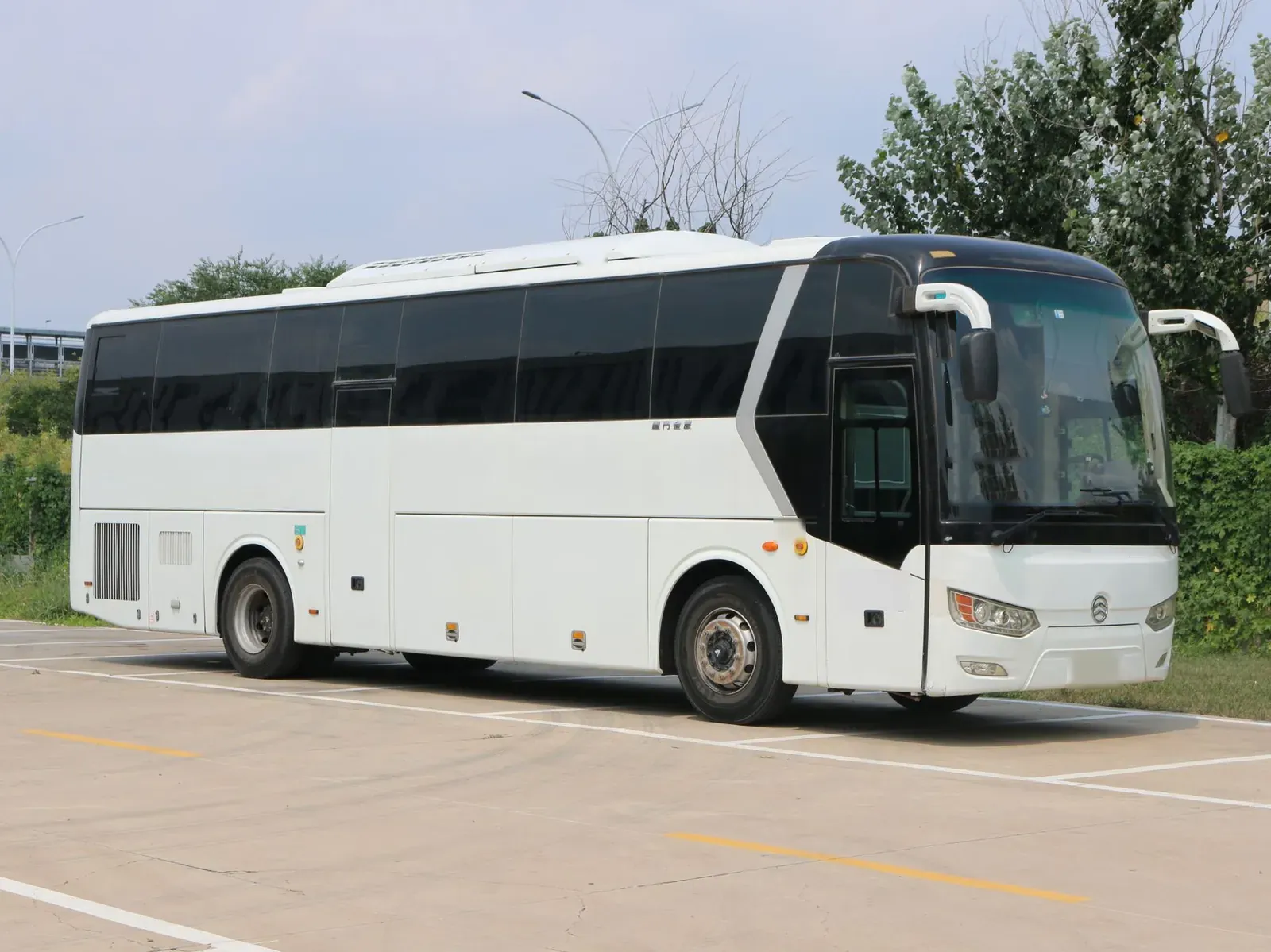 A white 50 passenger motor coach