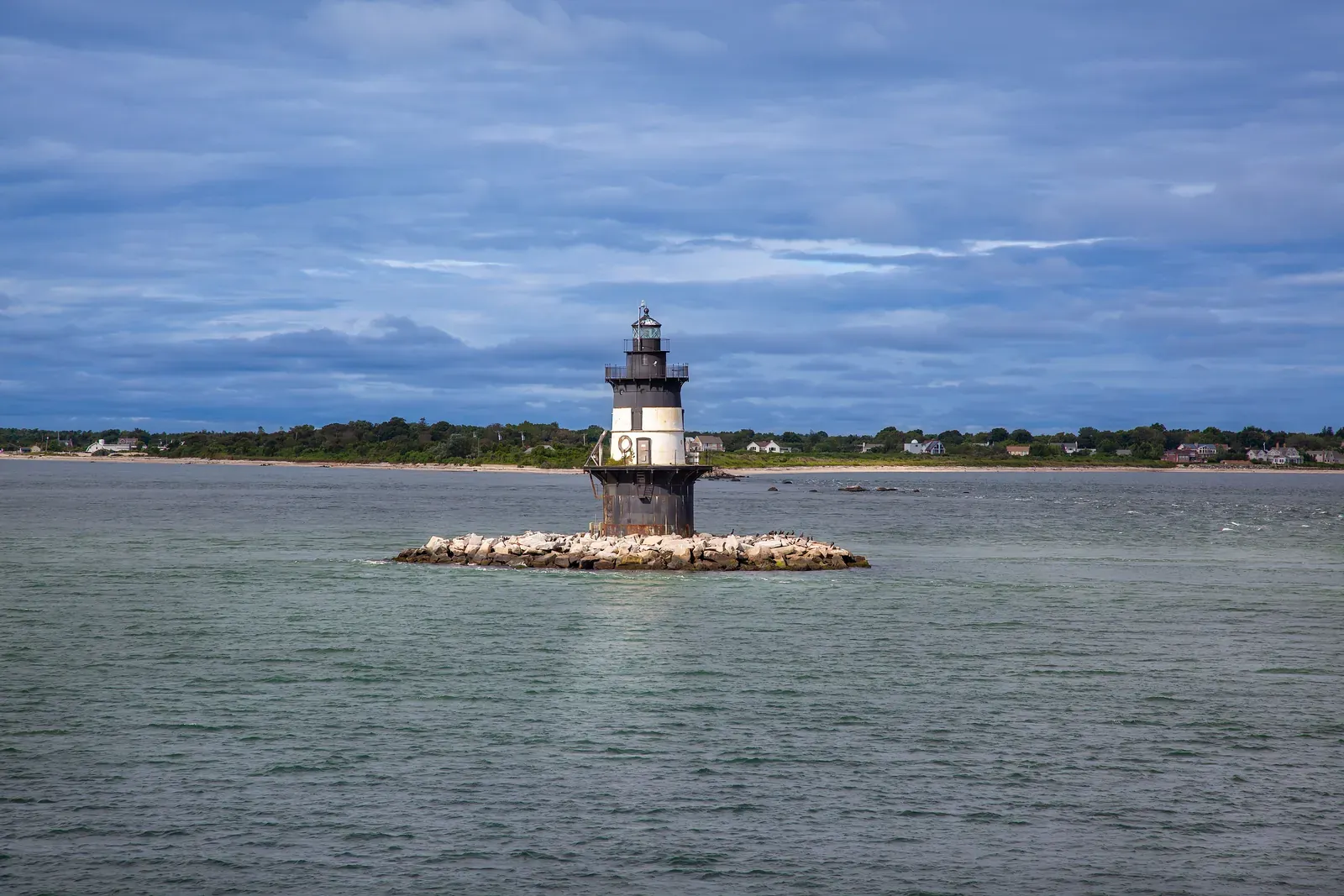Orient Point Lighthouse on its rocky islet off Orient Point