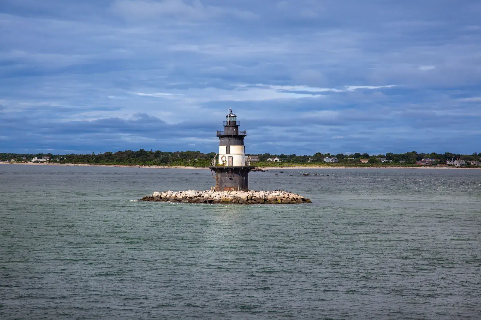 Orient Point Lighthouse on its rocky islet off Orient Point